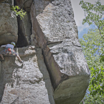 Climber climbing some crack rock