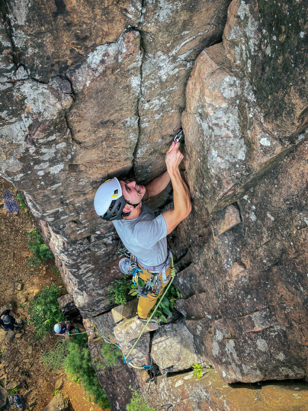 A person rock climbing in Ragged Mountains