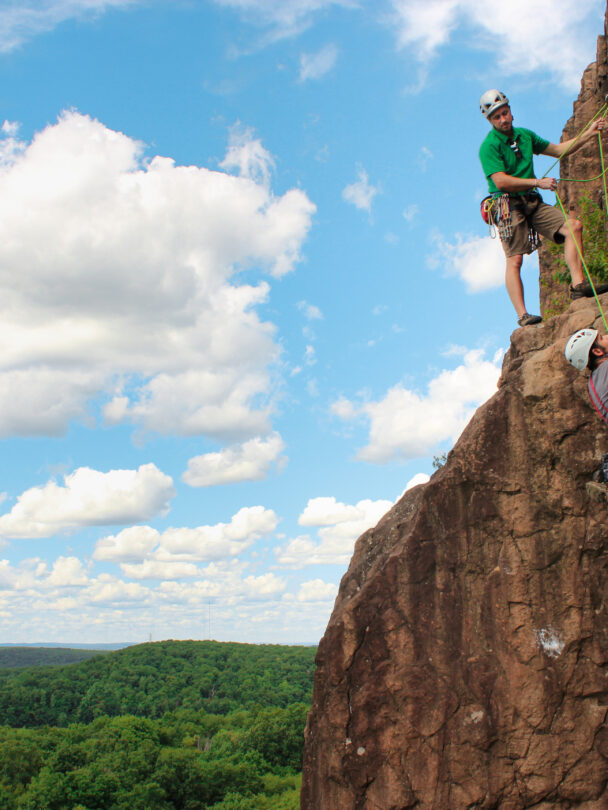 A person rock climbing in Ragged Mountains