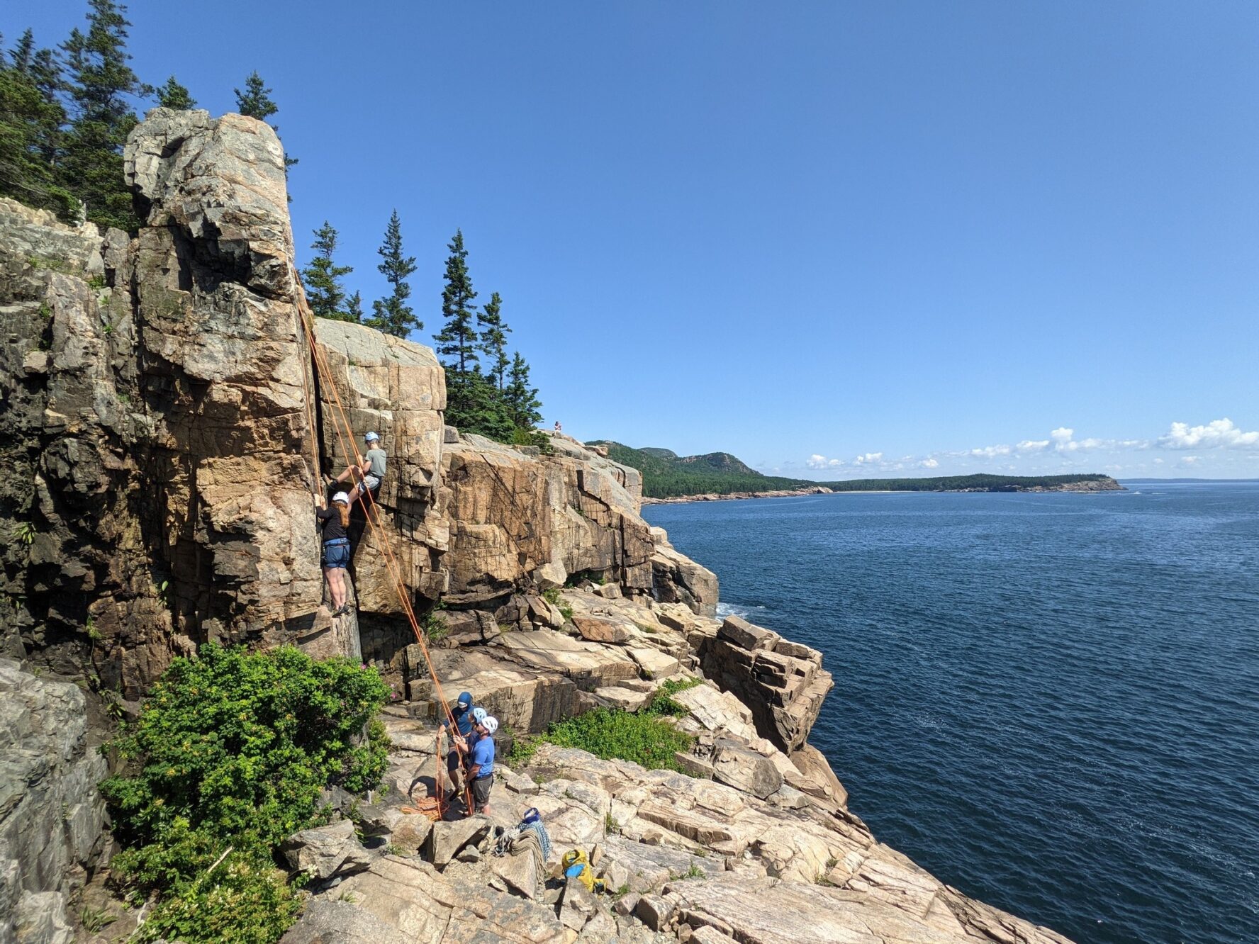 Climbers on a wall in Acadia National Park