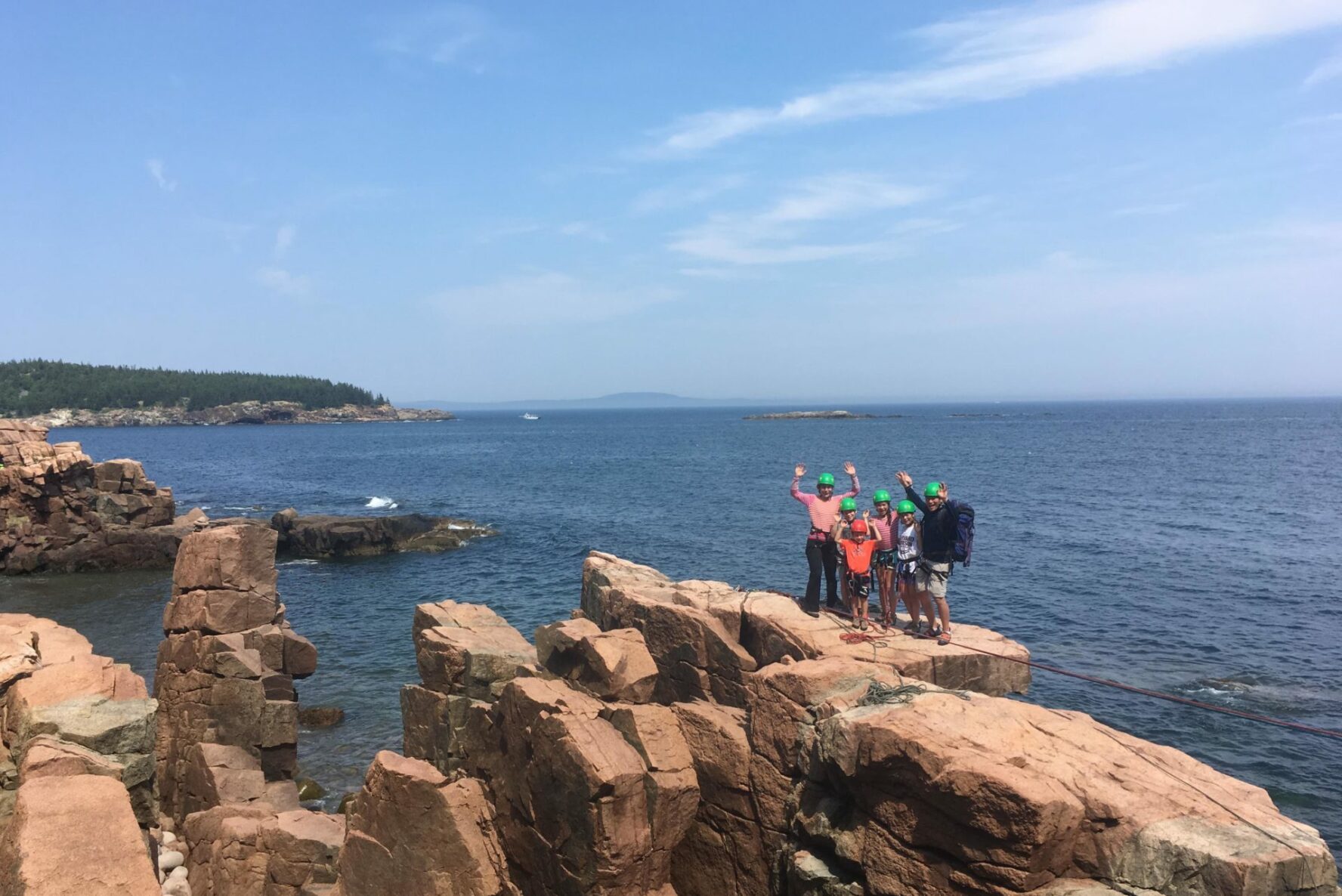 Family rock climbing in Acadia, ME