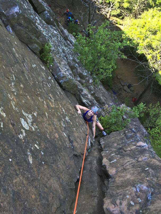 A person rock climbing in Ragged Mountains