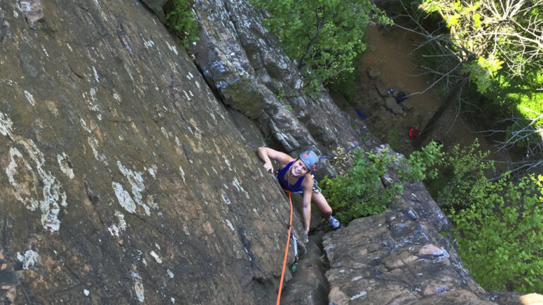 A person rock climbing in Ragged Mountains
