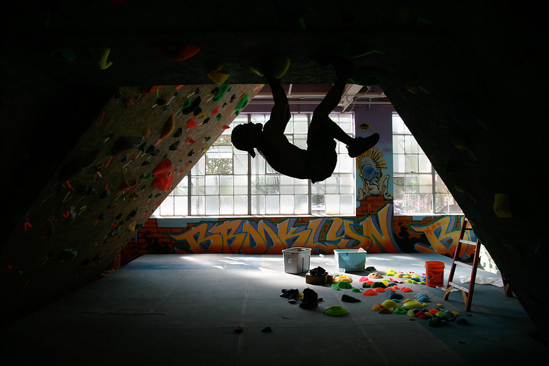 A climber just hanging out in Brooklyn Boulders.