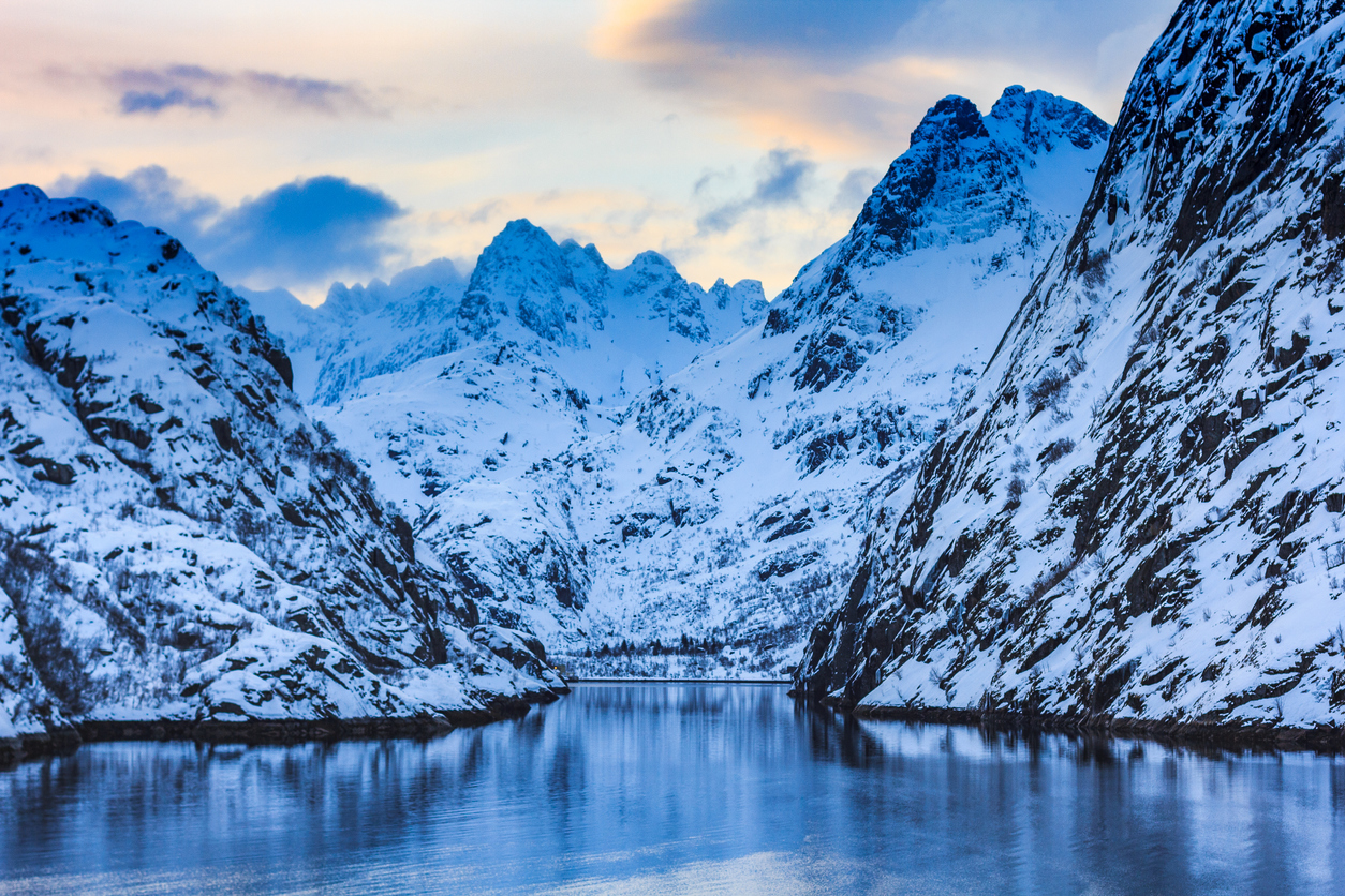 View of Trollfjorden whose walls are covered in snow.