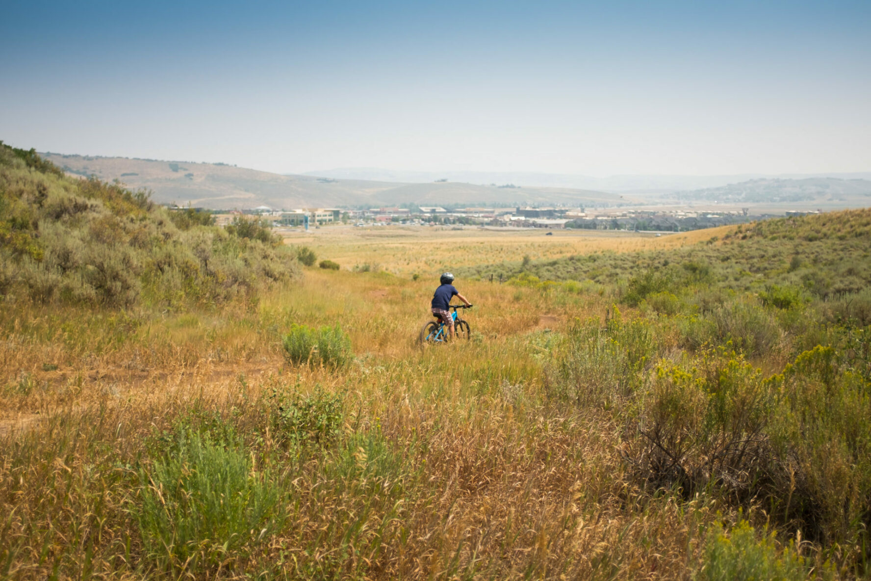 Kid riding mountain bike in Park City, Utah