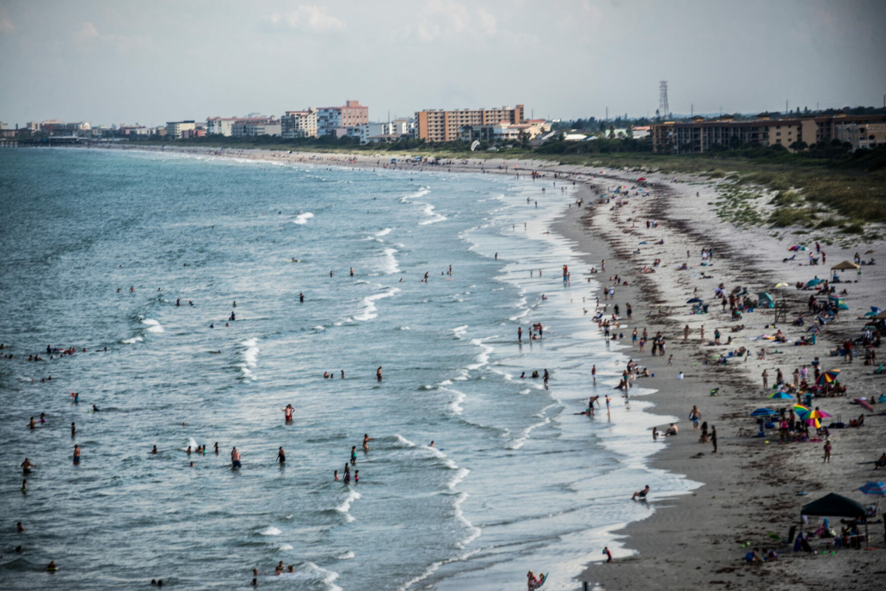 Swimmers and surfers on cocoa beach