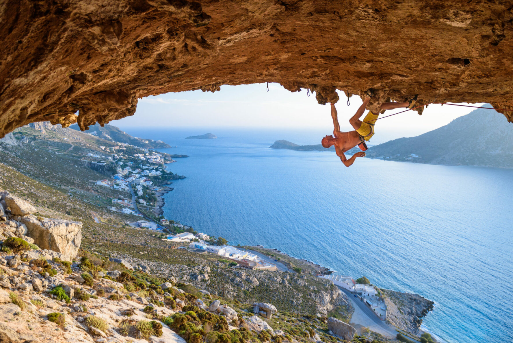 Rock climber at Scenic Rocks in beautiful golden light on a sunny day. Destination Greece, Europe