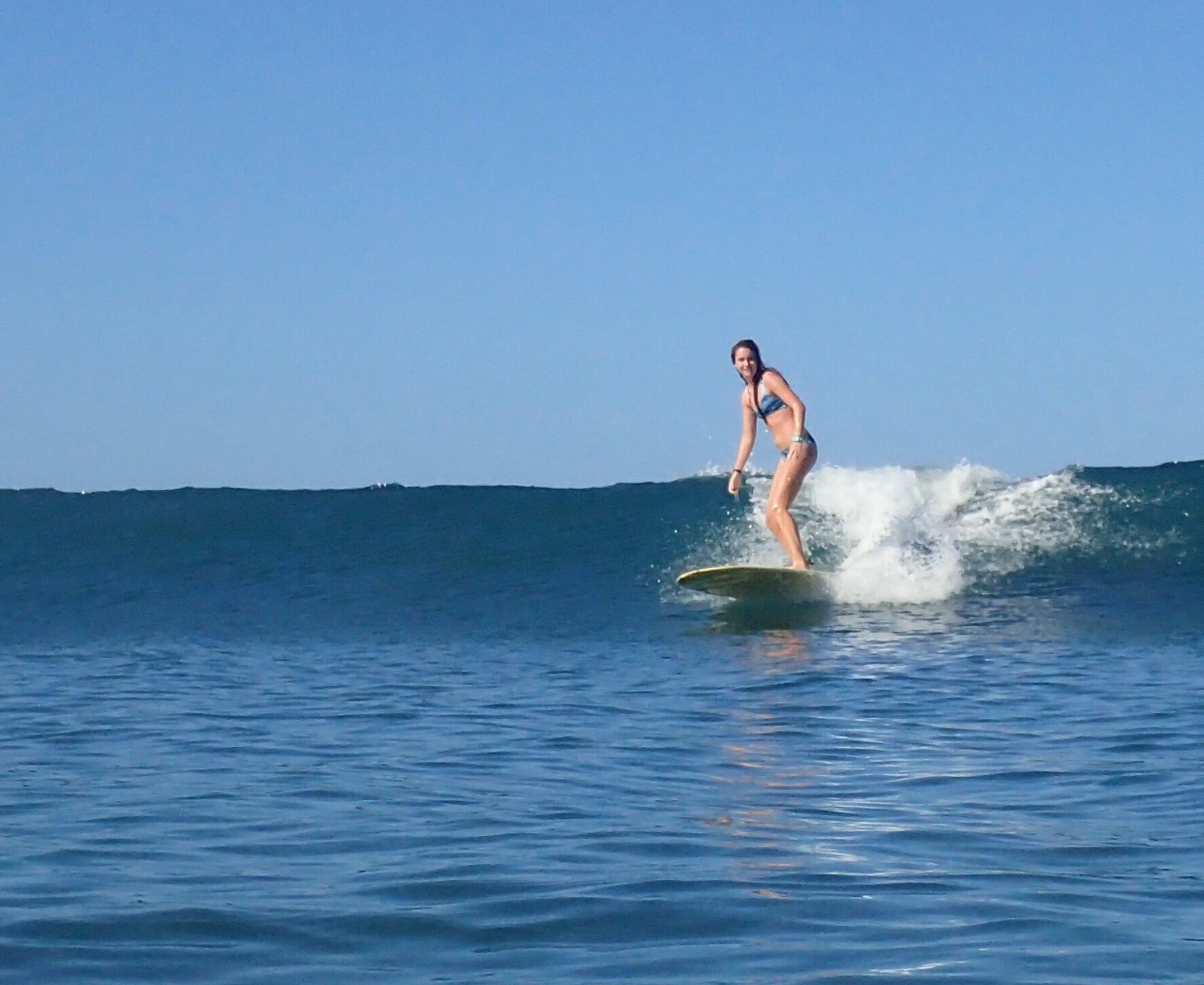 The author, Rebecca Parsons, surfing in Nosara.