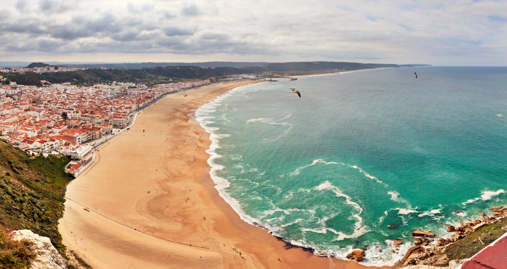 Panoramic aerial view of Nazare Beach on a summer day
