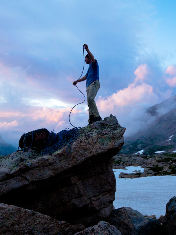 "Female climber makes the traverse from one line to the next on the fourth pitch of Orange Julius - Lumpy Ridge, Rocky Mountain National Park."