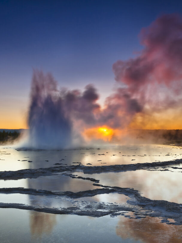 "Woman looking at Lower Falls at Yellowstone National Park, Wyoming, USA."