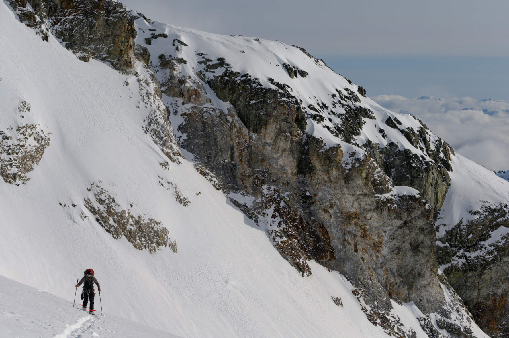 A skier and cliffs near Whistler