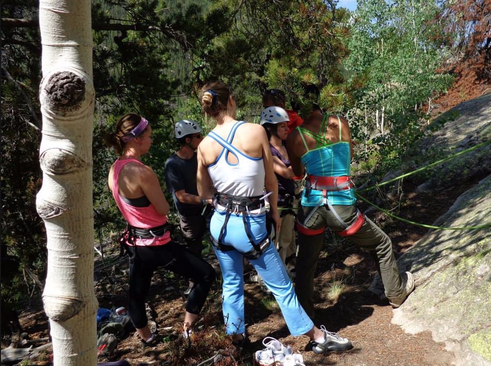 Women preparing for rock climbing in Colorado