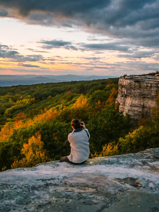 A young climber finishing a route in the Gunks