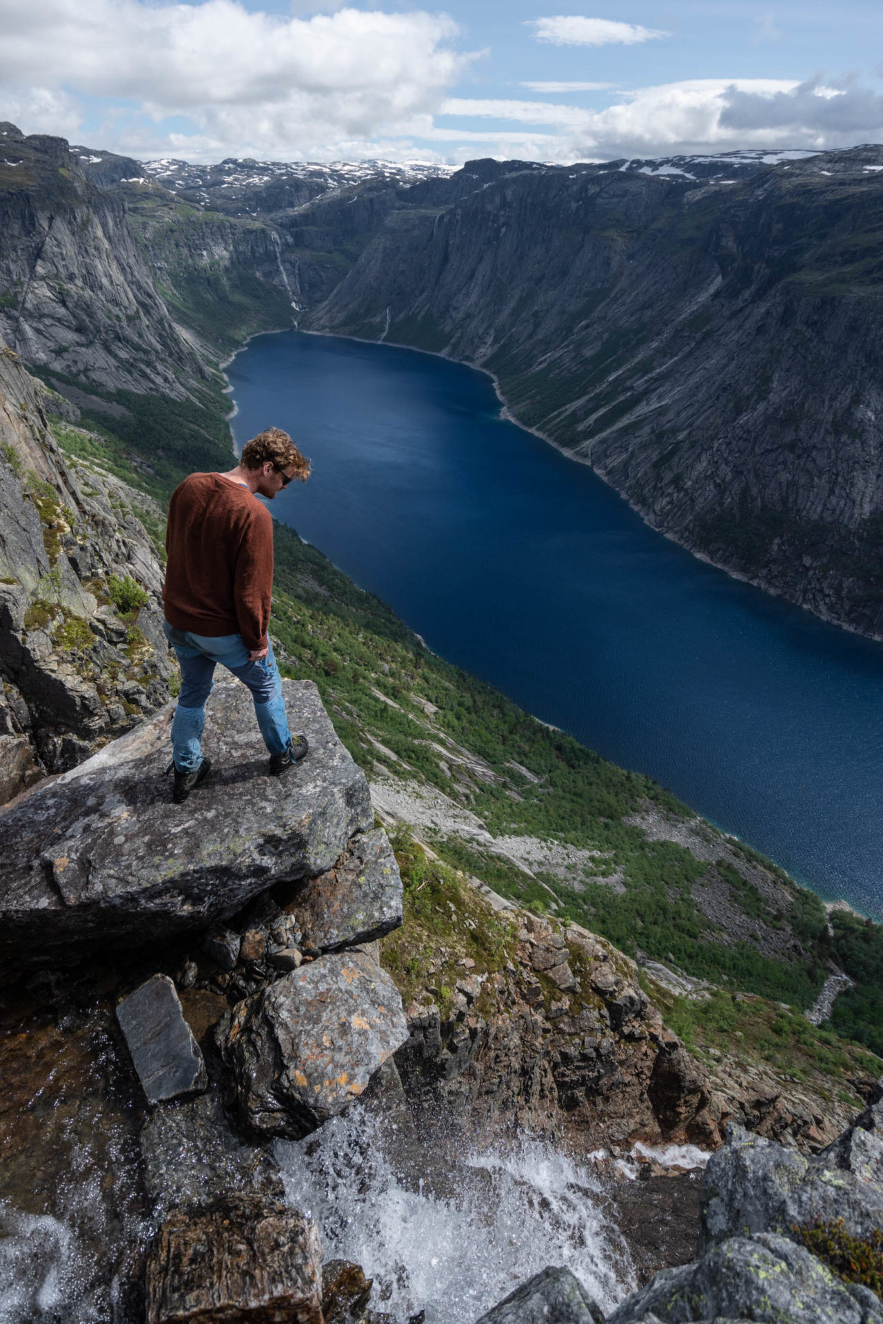 A hiker looking down, Trolltunga