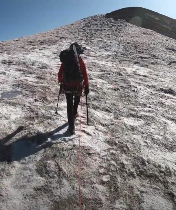 Hikers toward Easton glacier on the souther flank of Mt Baker - 10,781 ft. This image is taken on the Railroad Grade trail, Washington State.