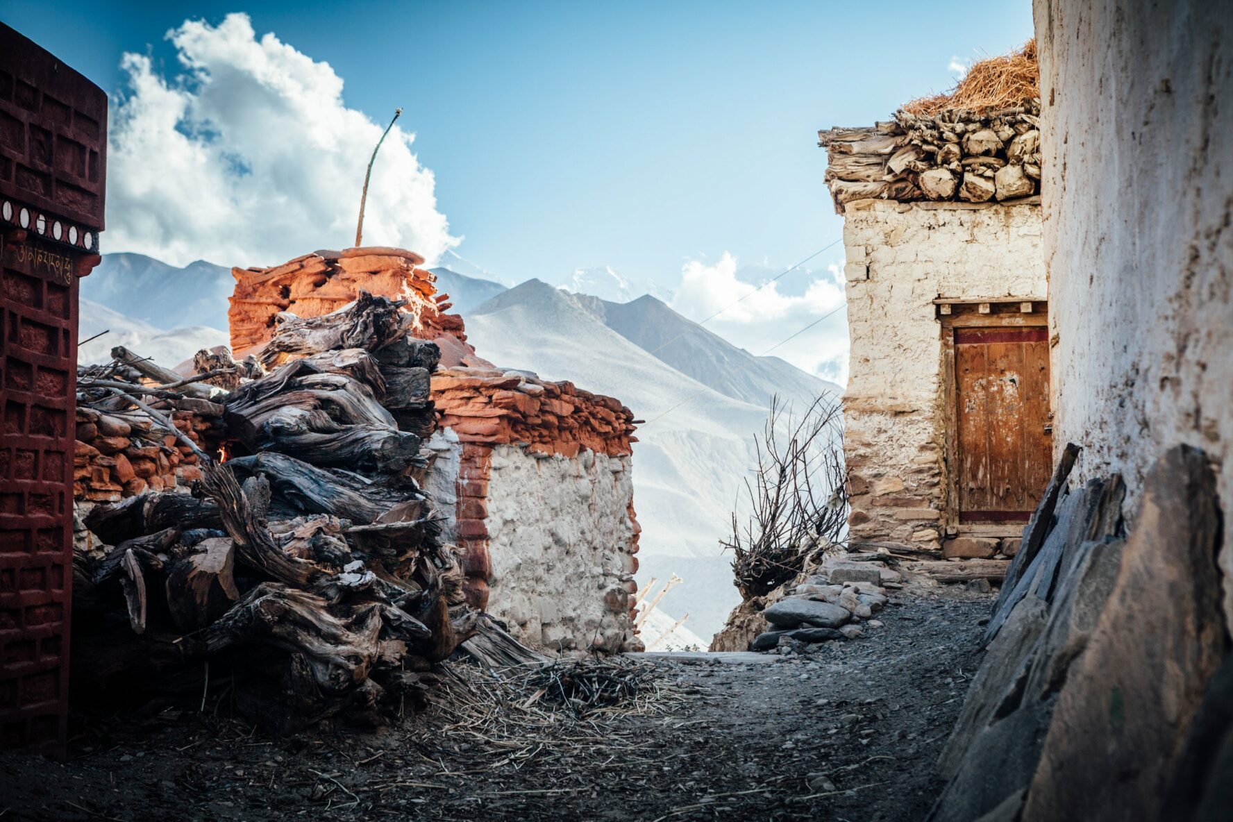 Streets of Upper Mustang in ruins. White Himalayas seen in the background