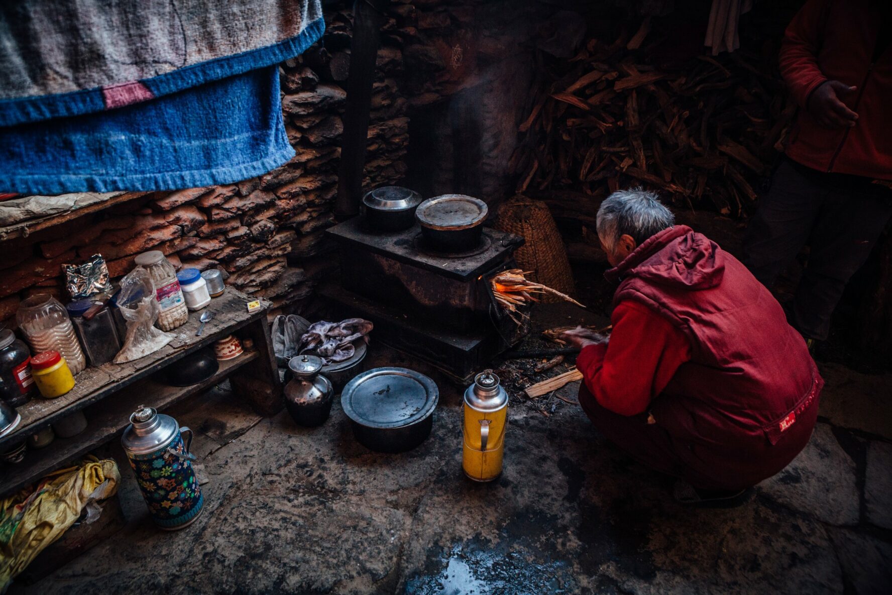 A Nepali man showing the traditional way of life in a small hut