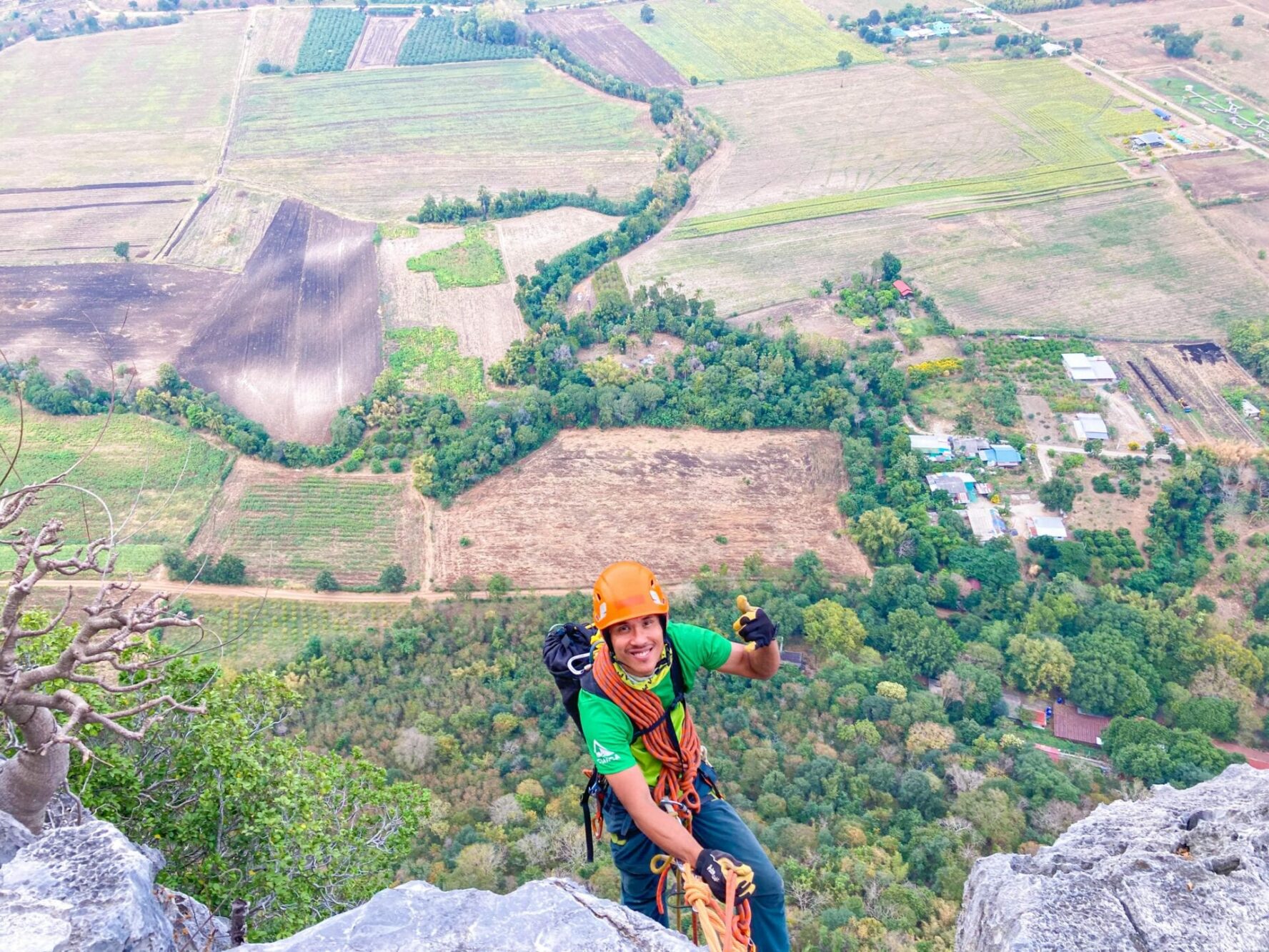 Man climbing Khao Jin Lae in Lopburi, Thailand