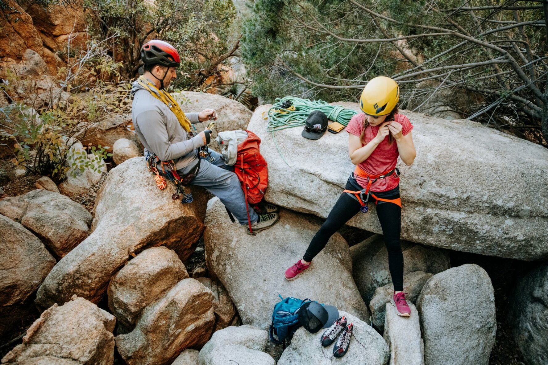 Two people preparing for climbing Cochise Stronghold