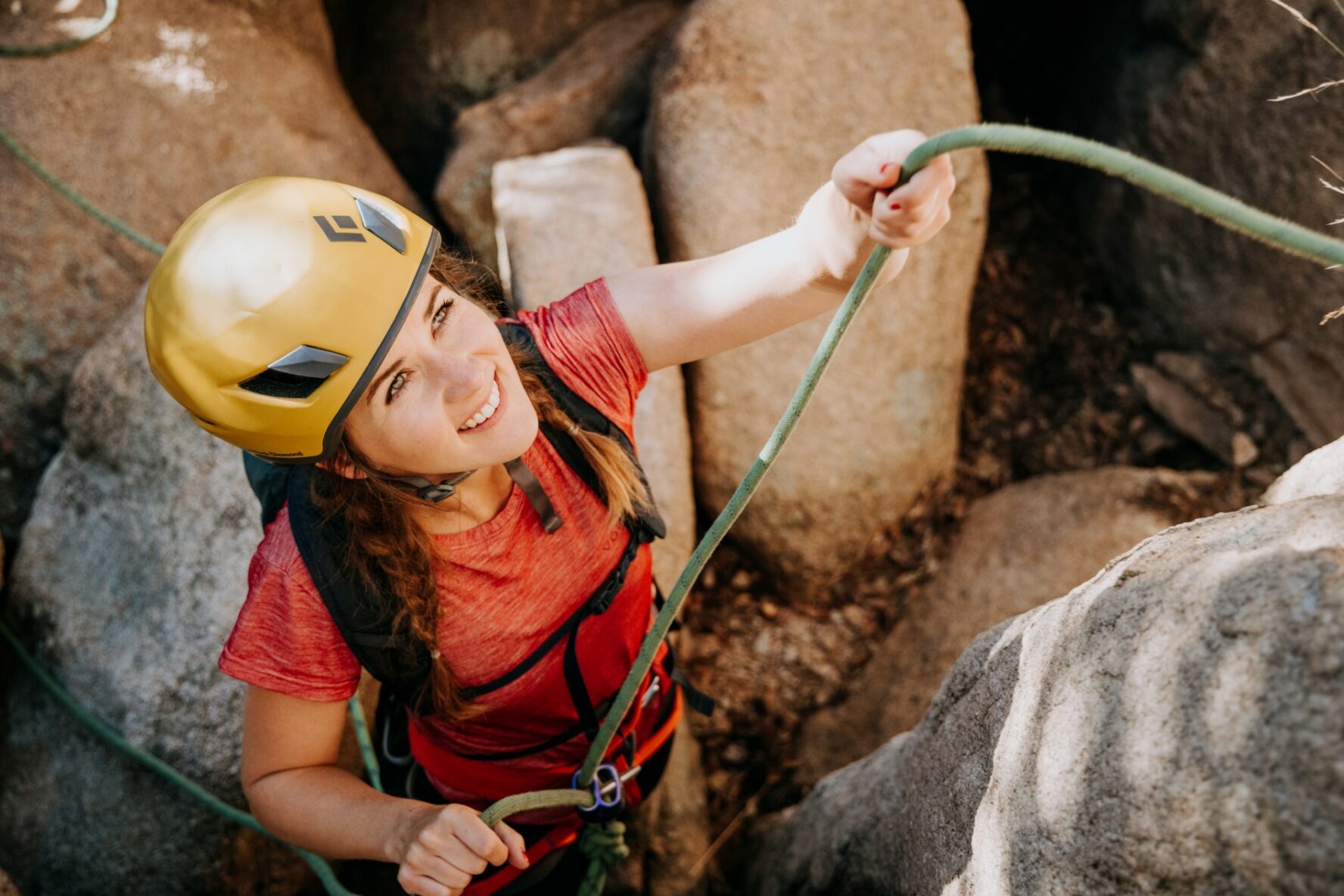 Woman smiling while climbing Cochise Stronghold