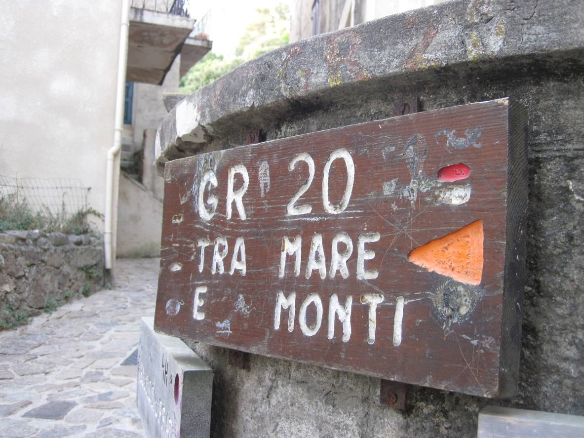 Wooden signpost for hikers in Corsica along the GR 20