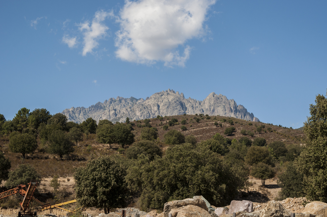 Corsica: the wild landscape of the inland with view of Monte Cinto, the highest mountain on the island and one of the most prominent peaks in Europe