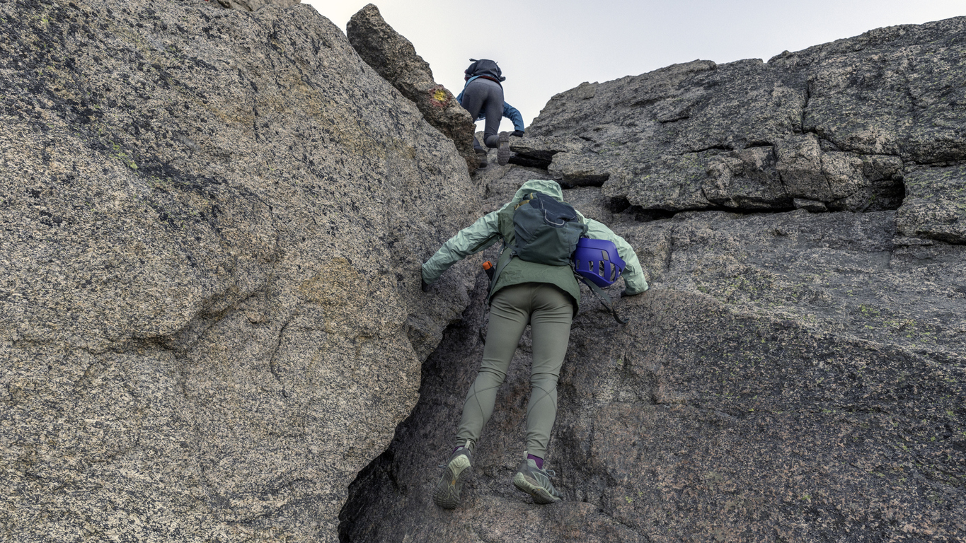 Climbing up through the crux at the top of the Trough, Keyhole route on Longs Peak Colorado 14er