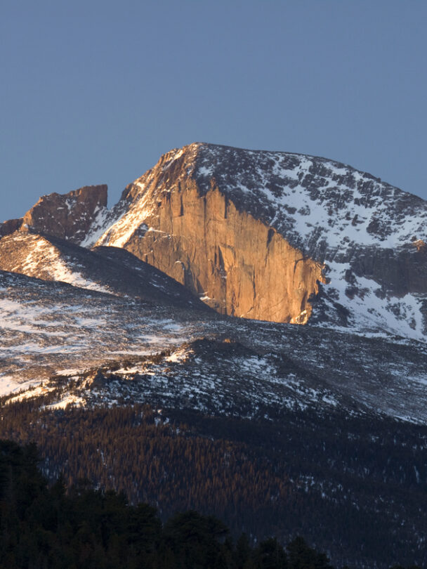 Longs Peak with trail map scene guiding your way many people die climbing this mountain. Estes Park , Colorado is near the Long Peak many many people attempt to climb this Peak and some do not survive. This shows the peak in Summer on a perfect day to climb. A colorado 14er
