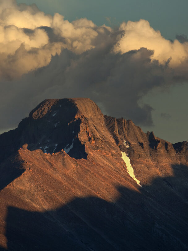 Longs Peak with trail map scene guiding your way many people die climbing this mountain. Estes Park , Colorado is near the Long Peak many many people attempt to climb this Peak and some do not survive. This shows the peak in Summer on a perfect day to climb. A colorado 14er
