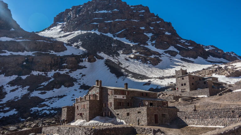 Toubkal national park in springtime with mount, cover by snow and ice, Refuge Toubkal, start point for hike to Jebel Toubkal, – highest peak of Atlas mountains and Morocco