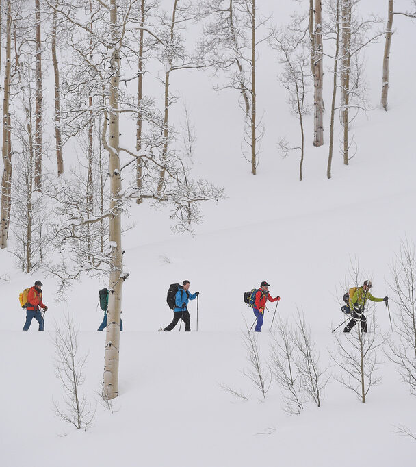 Avalanche Education in Crested Butte, a man measures snow