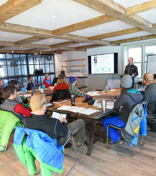 Avalanche Education in Crested Butte, a man measures snow