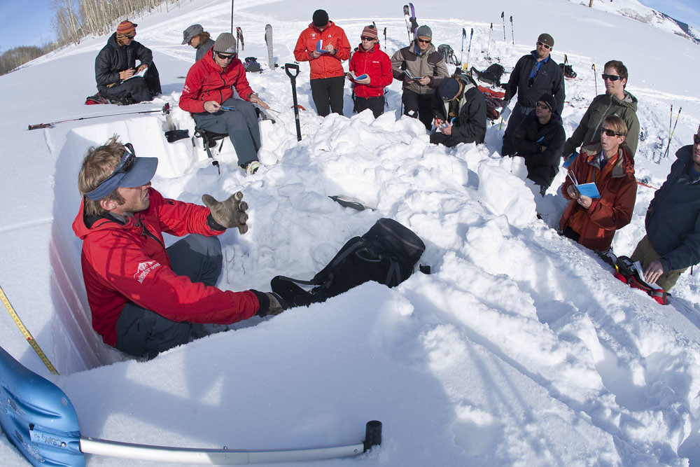 A group of people learning about avalanche on an AIARE Refresher course in Crested Butte
