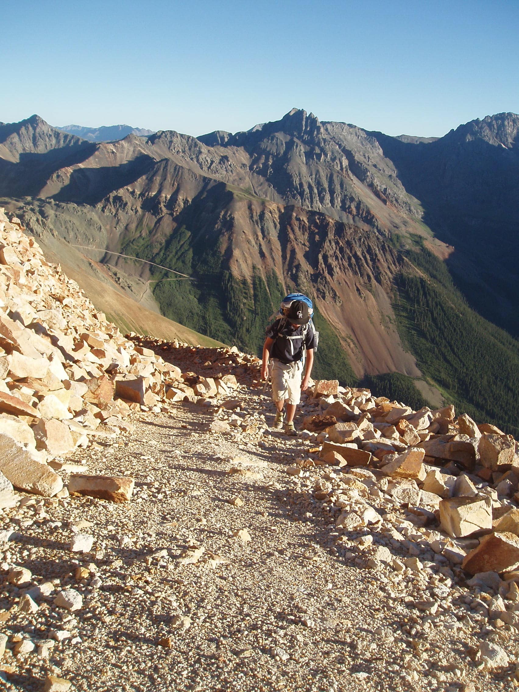 A person hiking along a trail in Telluride