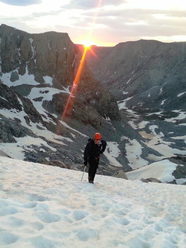 Beautiful sunrise while climbing the peak