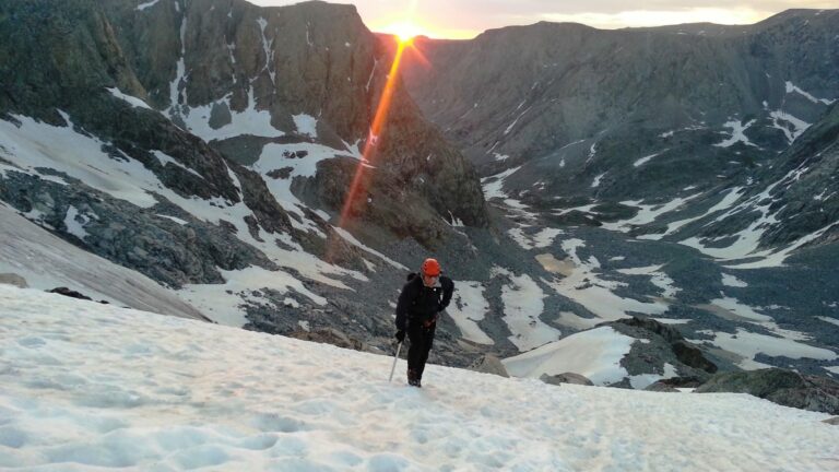 Beautiful sunrise while climbing the peak