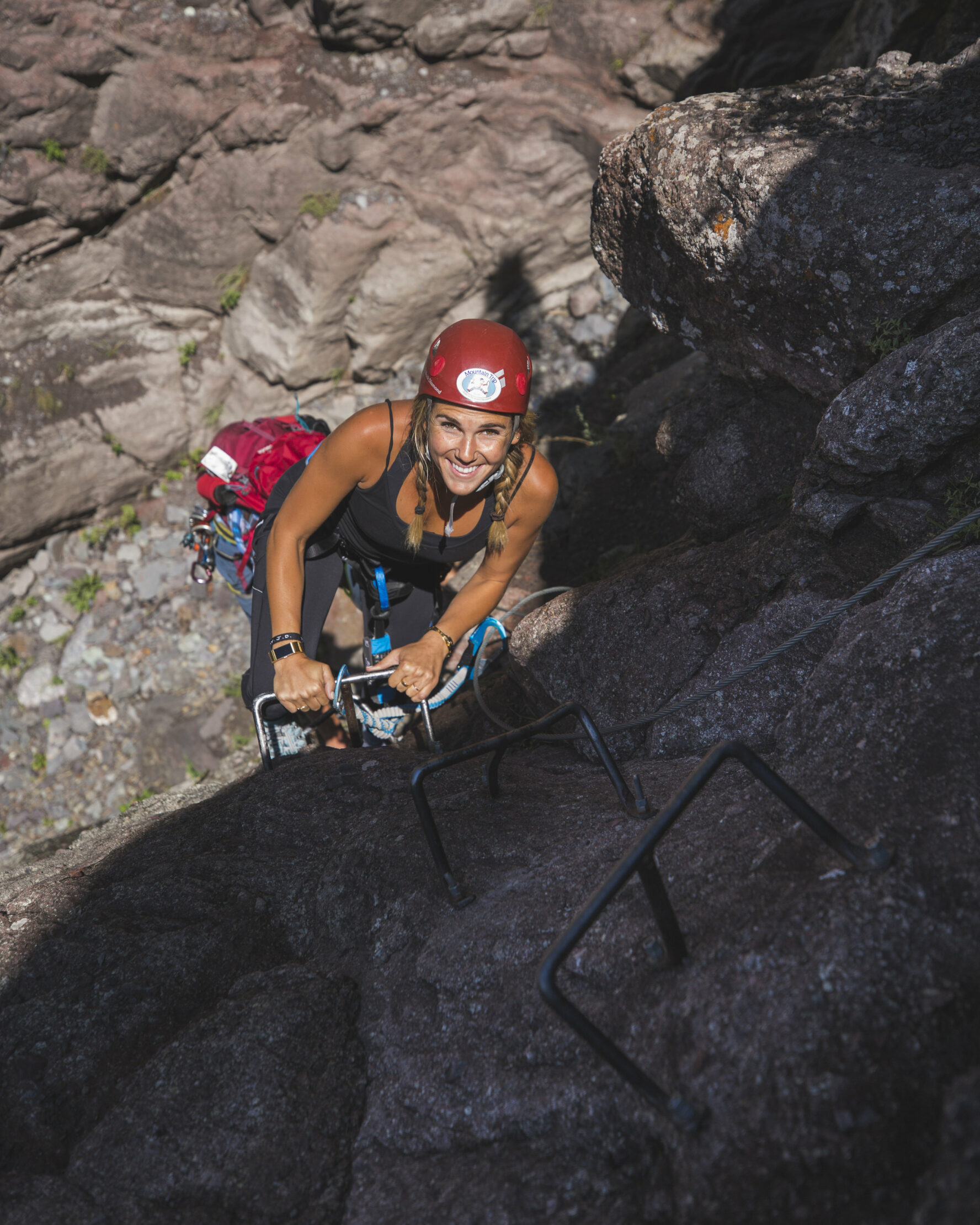 A climber looking up while climbing