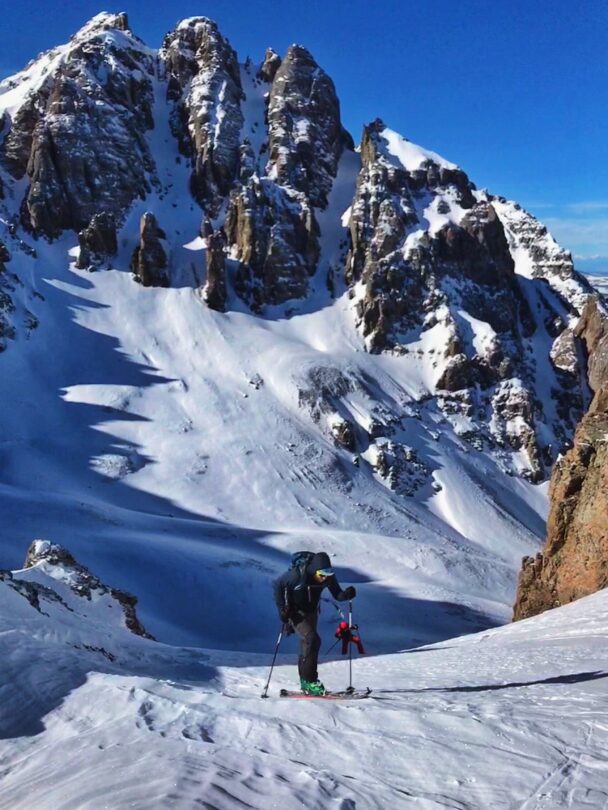 A skier enjoying the dawn from Telluride's snowy backcountry