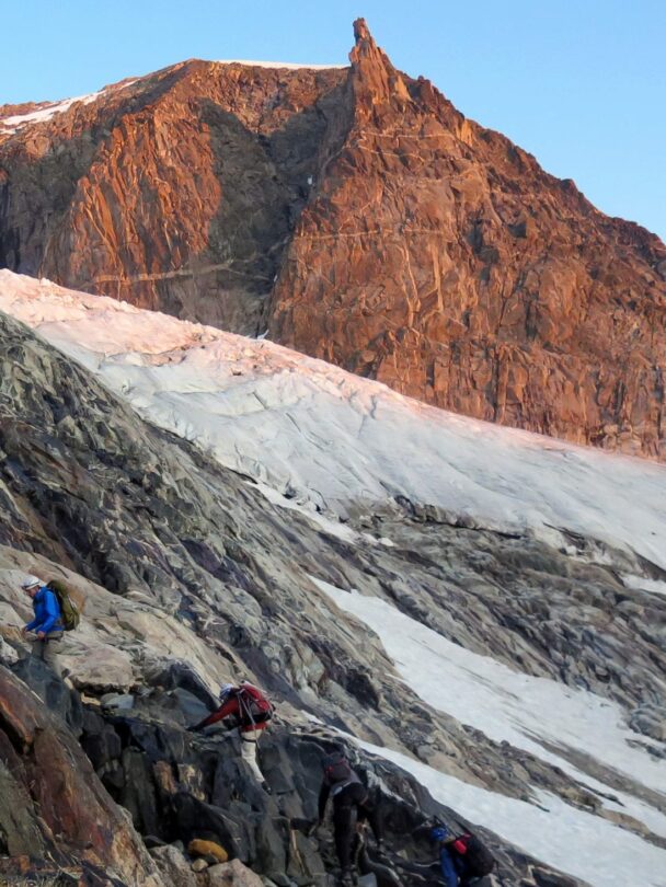 Beautiful sunrise while climbing the peak