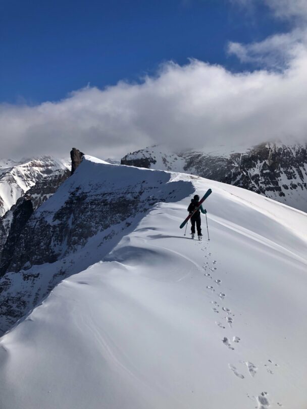 A skier enjoying the dawn from Telluride's snowy backcountry
