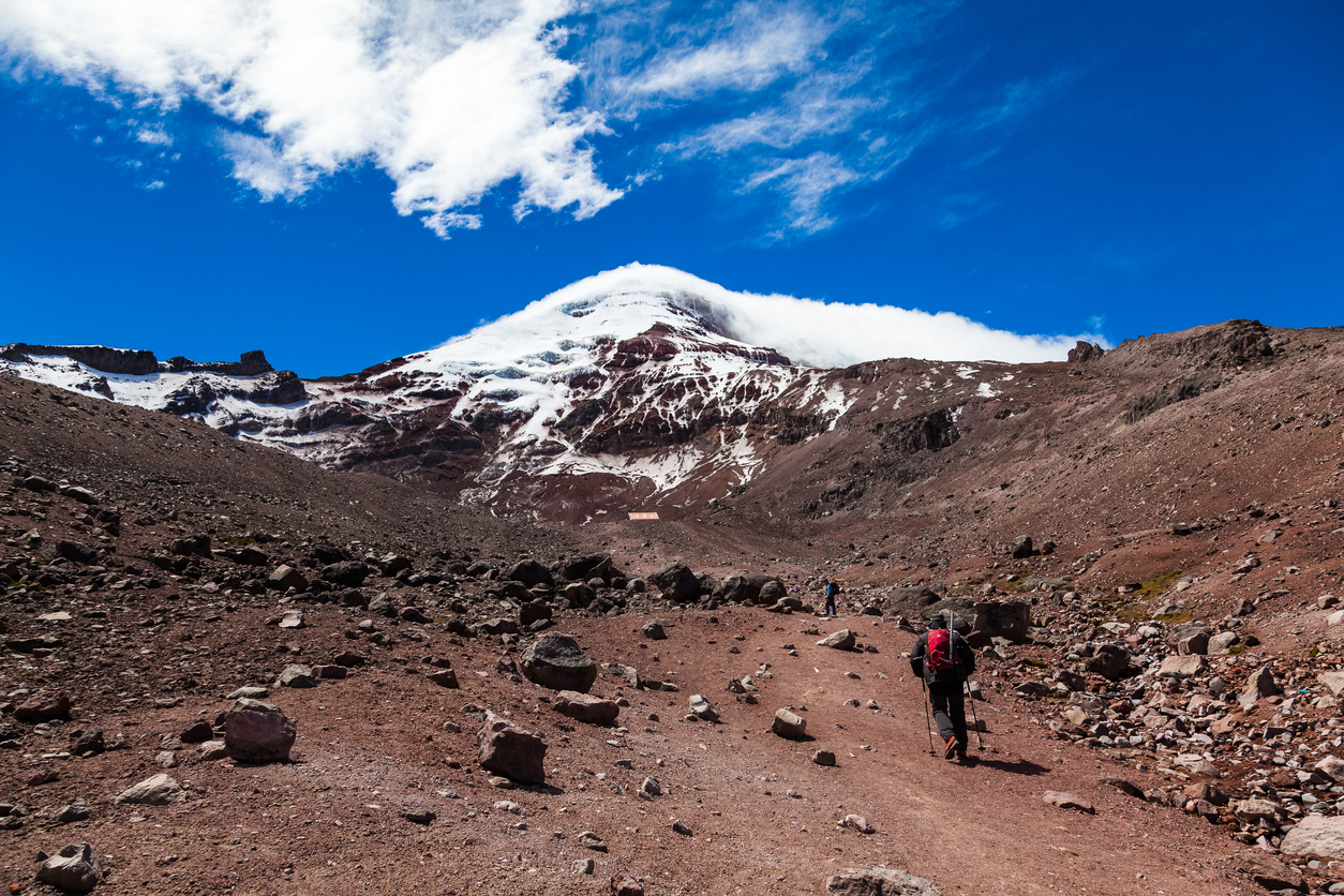 Climbing the refuge of the Chimborazo volcano on a very windy summer afternoon