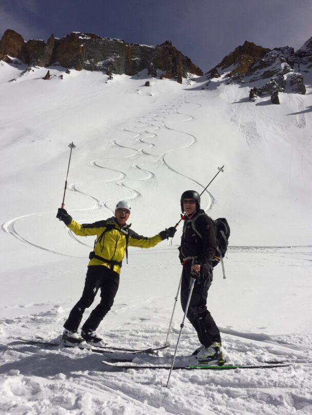 A skier enjoying the dawn from Telluride's snowy backcountry