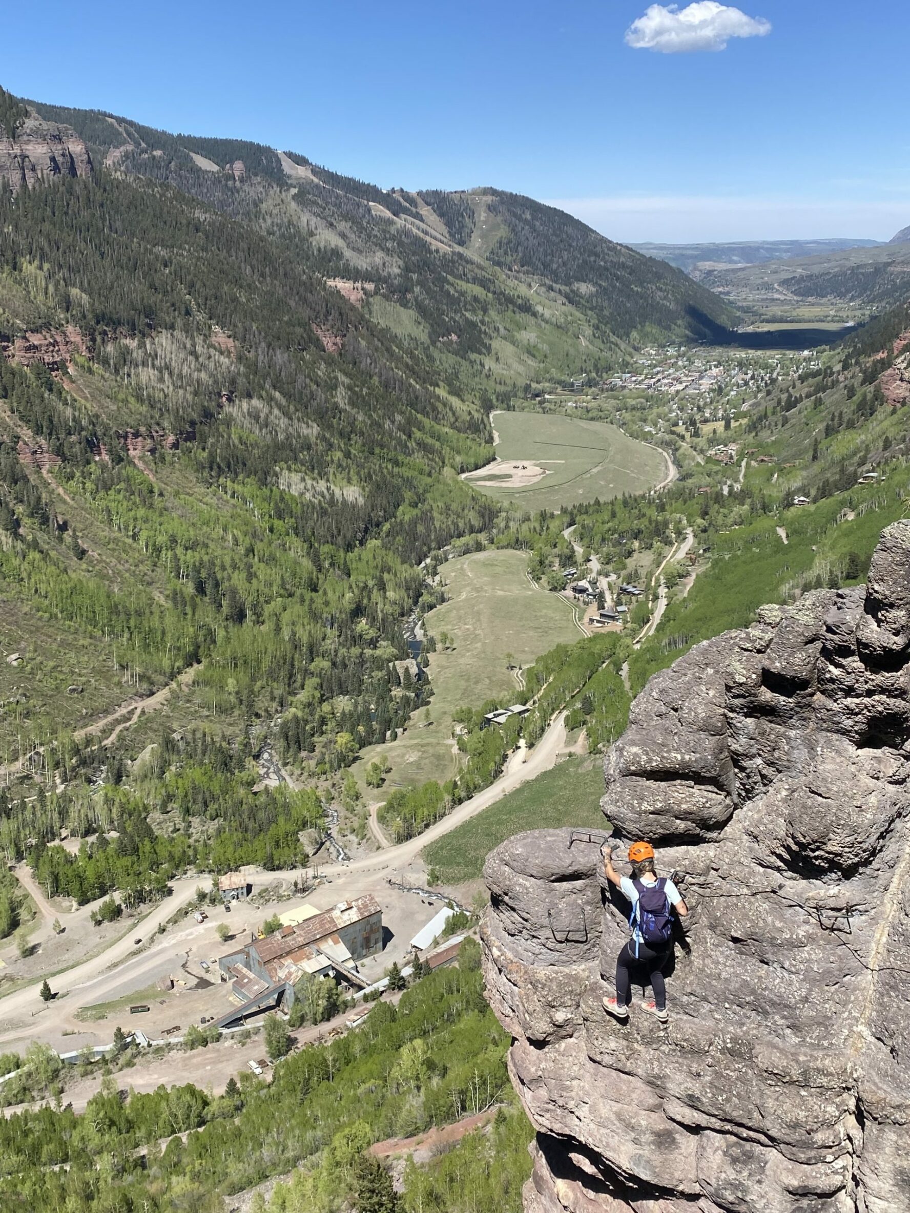 Climber on an exposed cliff in Telluride