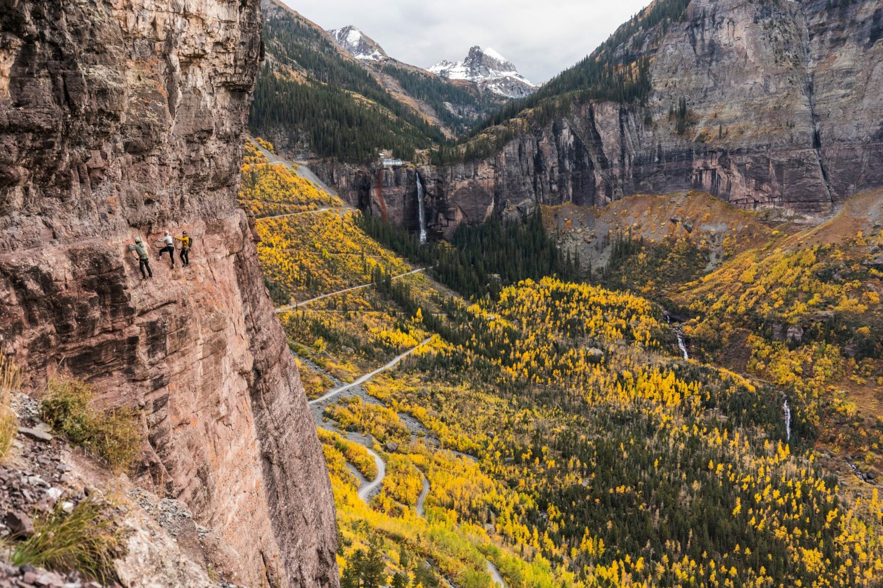 Climbers on an exposed section of the Telluride via ferrata