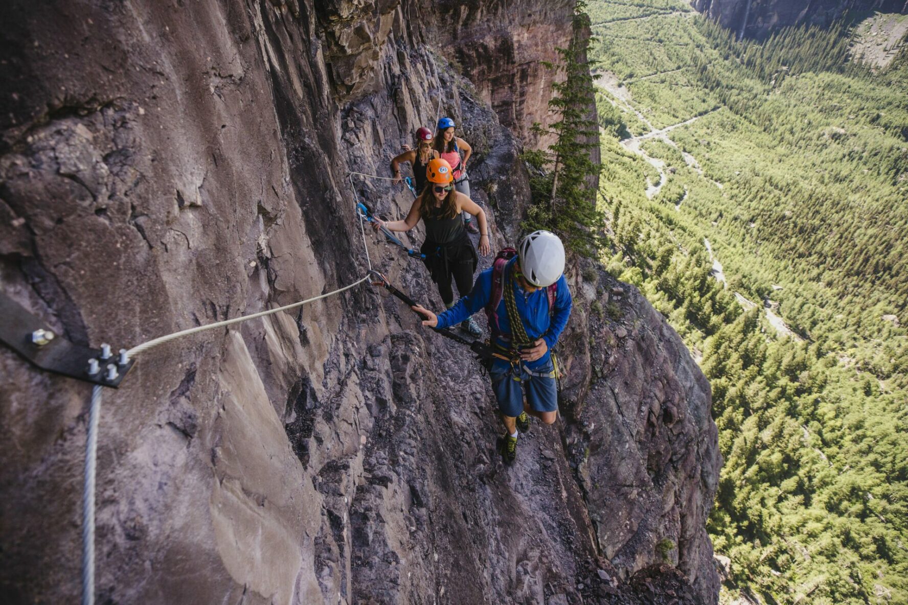 Climbers enjoying the scenery on the Telluride via ferrata, Colorado