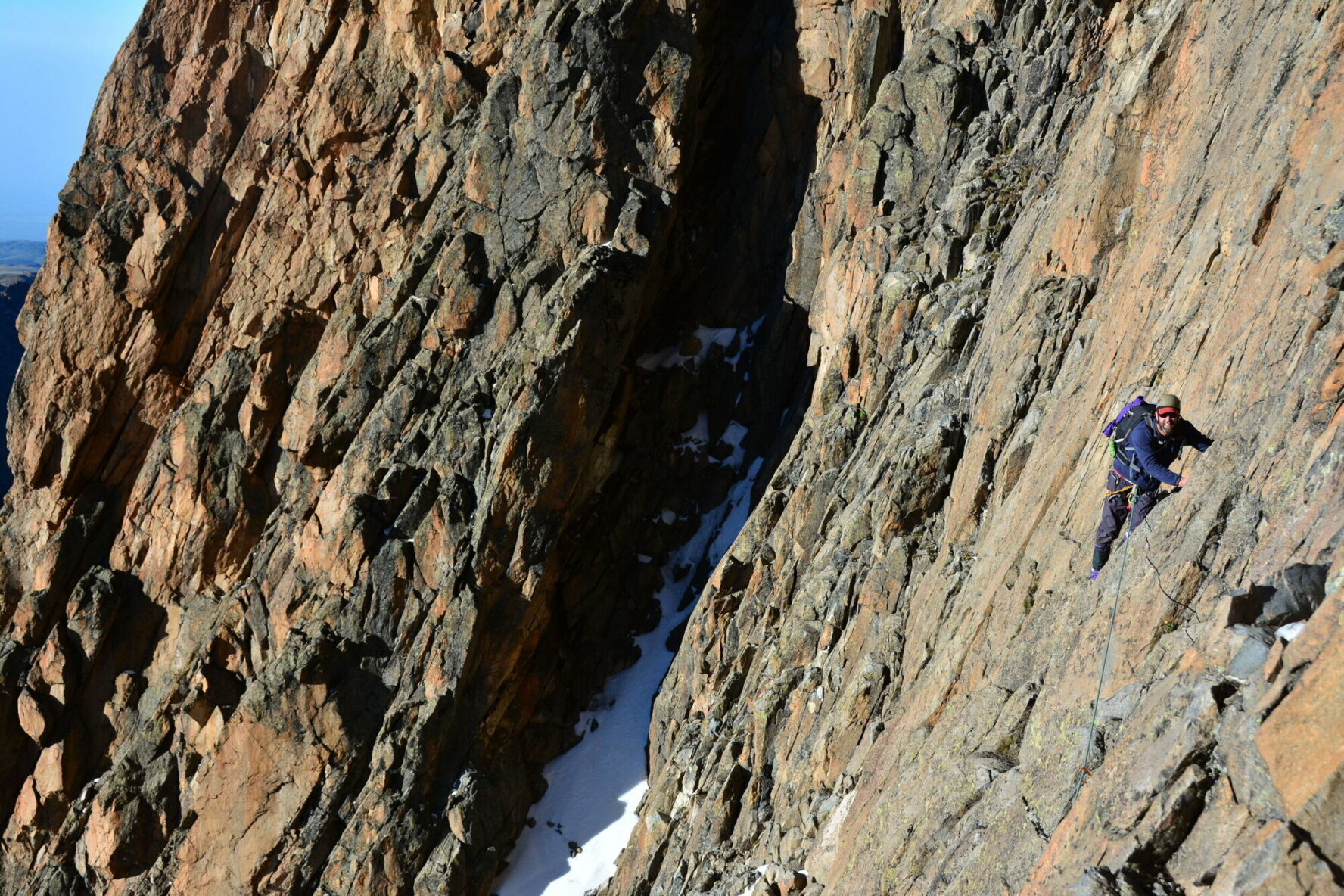 A climber on some cliffs near the Chogoria summit