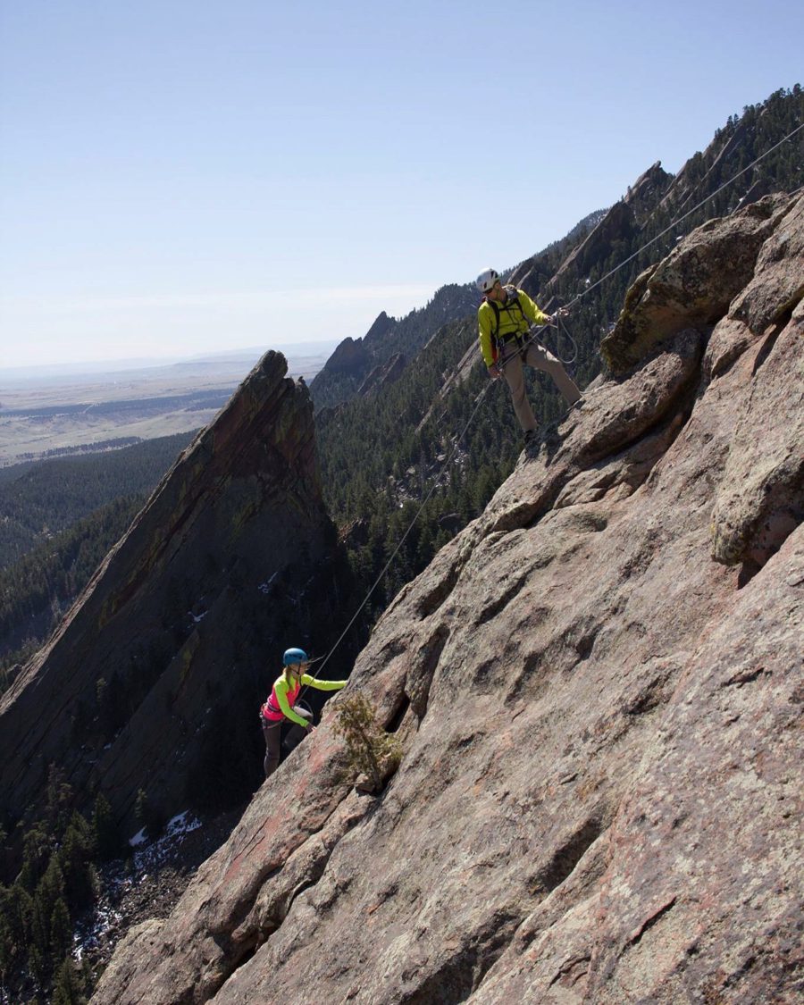 Two climbers ascending a cliff in the Flatirons