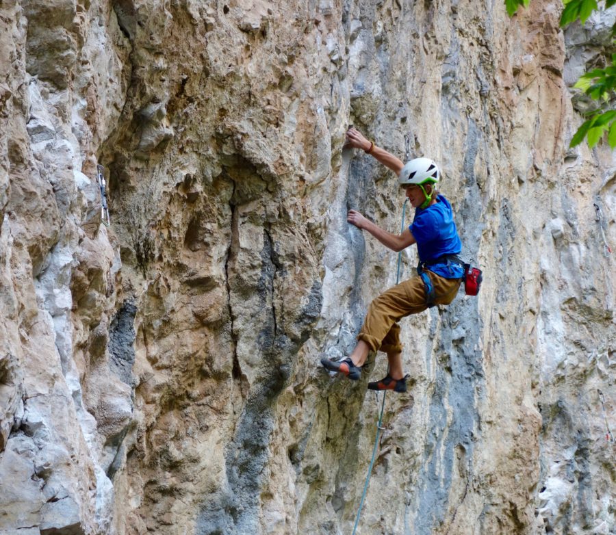 A man climbing a cliff in Rifle